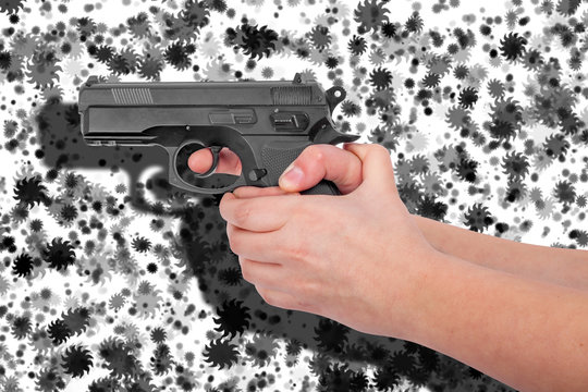 
Hand holding a gun isolated on black and white background