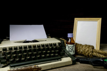 Fototapeta Typewriter with paper page and poison and gun. Concept writer Ro obraz