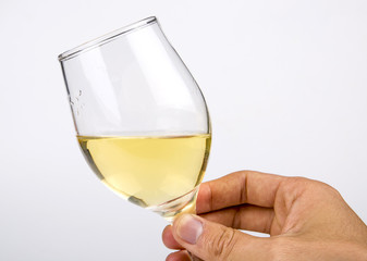 Holding hands a glass of white wine closeup