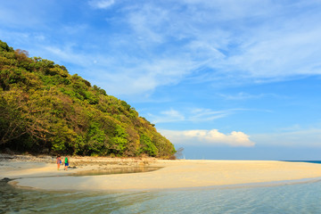 Young couple walking together on a beach. Koh Rok island, Krabi, Thailand.