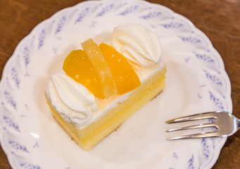 Delicious cheese cake with peach on top.
