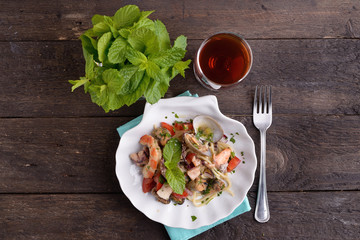 Shaped dish of scallops with mixed seafood