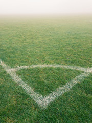 KIRKBY IN ASHFIELD, ENGLAND - OCTOBER 31: Corner arc of football pitch in the fog, England. In Kirkby In Ashfield, Nottinghamshire, England. On 31st October 2016. © jasonbatterham