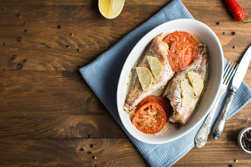 Baked sea bass with tomatoes and lemon
