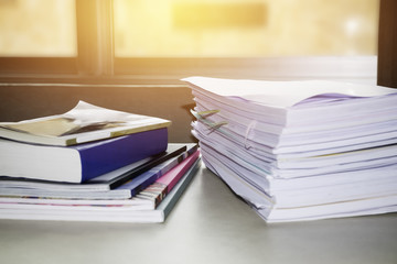 Pile of unfinished documents on office desk, Stack of business paper