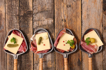 raclette cheese and meats