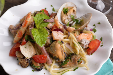 Shaped dish of scallops with mixed seafood