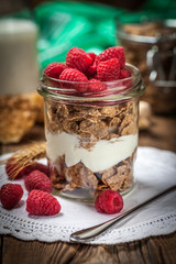 Bowl of cereals with blueberries and raspberrie.
