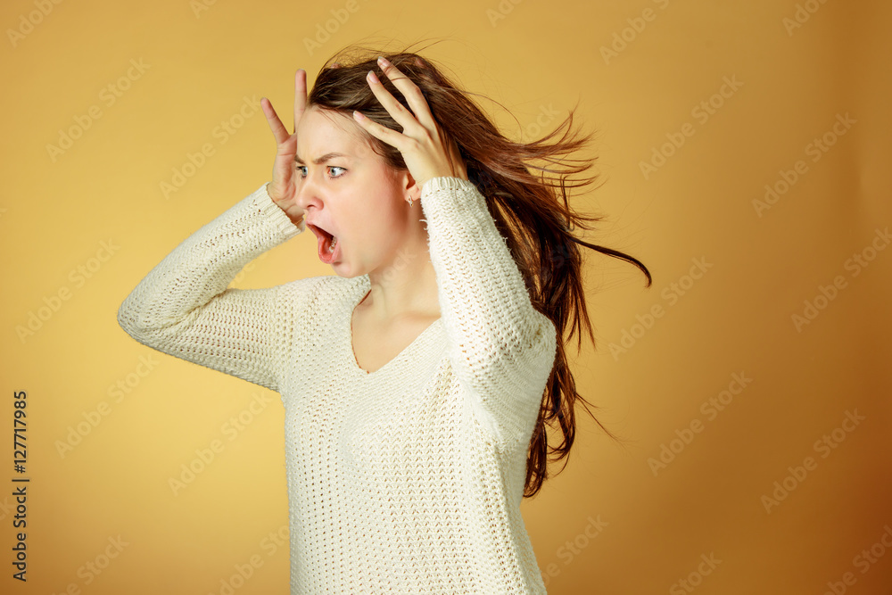 Wall mural portrait of young woman with shocked facial expression