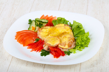 Pork steak with tomato and cheese