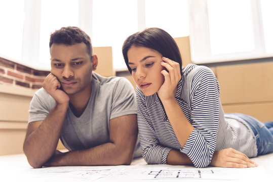 Young couple moving - Powered by Adobe