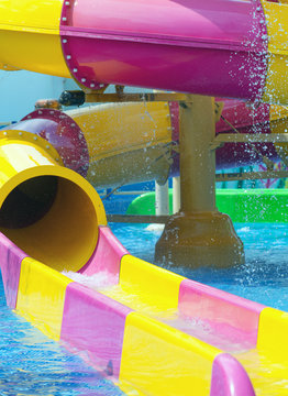Colorful water slides in waterpark resort.