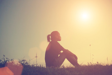 Sad and depressed woman sitting alone