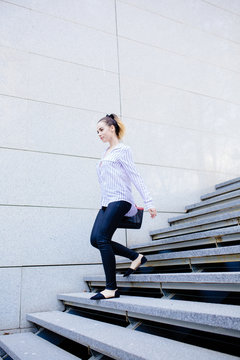 Businesswoman walking on the steps