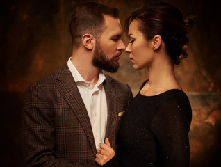 Portrait of well-dressed couple in expression of feelings