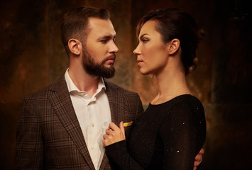 Portrait of well-dressed couple in expression of feelings