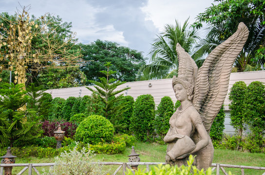 Female Thai Angel with Wing Tradition Art Green Garden Background