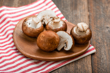 Mushrooms on a rustic wooden table. Copyspace.