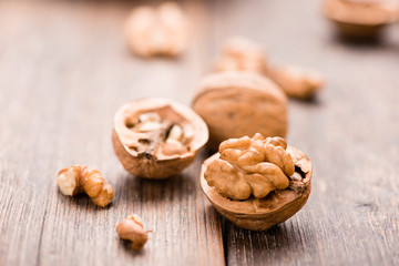 Walnuts on wooden table. Macro. Front view