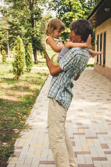 Fototapeta premium The family father and daughter outdoors.