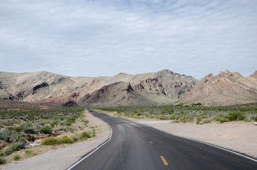 Road going towards arid mountains
