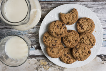 Cookies and Milk / Top View of Cookies and Milk on a Wooden Background
