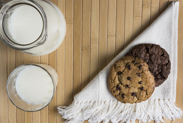 Cookies and Milk / Top View of Cookies and Milk on a Wooden Background