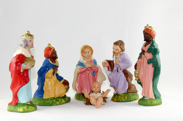 Fototapeta premium Christmas Isolated nativity scene with three Wise Men presenting gifts to baby Jesus, Mary & Joseph on white background