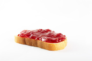 Sandwich of white bread and raspberry jam on an isolated background