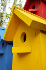 Yellow birdhouse closeup. Photos with limited depth of field.
