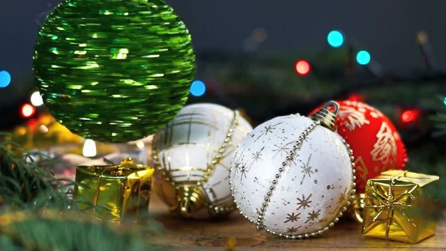 Vertiginous green christmas ball, gift boxes and candles 
	
