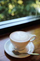 cappuccino coffee on wood background