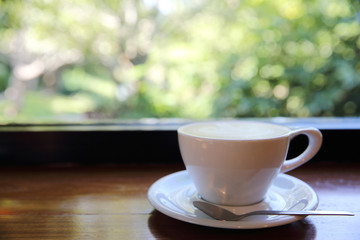 cappuccino coffee on wood background