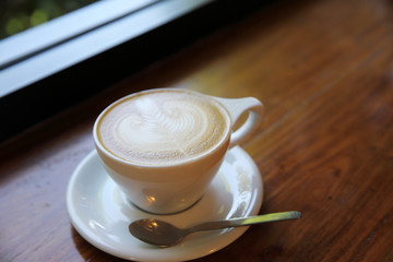 cappuccino coffee on wood background