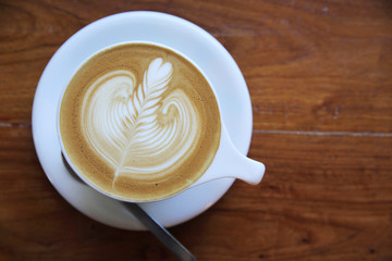 cappuccino coffee on wood background