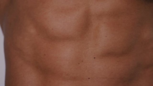 4K Body of a muscular man on display