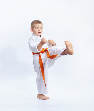 Boy in karategi beats kicking