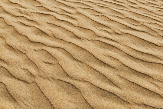 Waves of sand on the dune close-up shot.