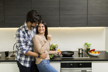 Young couple preparing meal