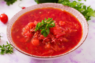 Traditional Ukrainian Russian vegetable borscht soup on light background
