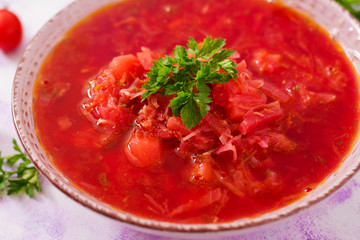 Traditional Ukrainian Russian vegetable borscht soup on light background