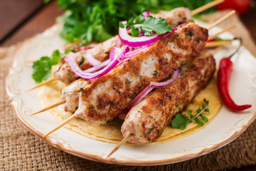 Minced Lula kebab grilled turkey (chicken) on plate.