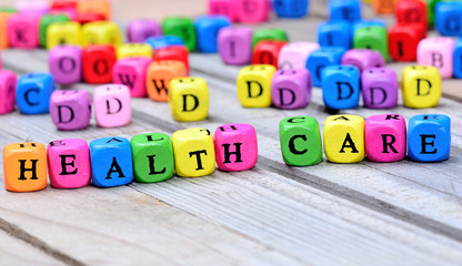 Health care words on wooden table