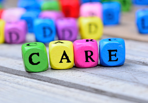 Care word on wooden table