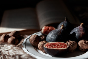 figs and nuts on a white plate
