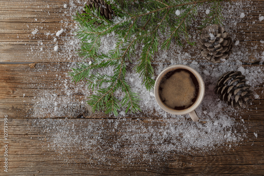 Wall mural hot coffee cup on a frosty winter day window background /christm