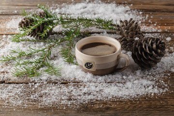 Obraz na płótnie Canvas Coffee in a mug, snow, tree