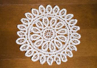 Circle handmade crochet on wooden texture