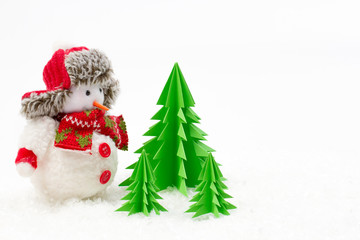 Christmas decoration, snowman with origami trees isolated on white background