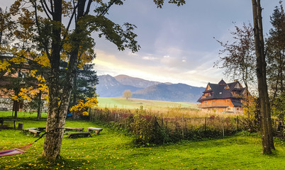 Traditional Wooden House in Mountains - obrazy, fototapety, plakaty